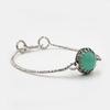 Hard silver bracelet inlaid with deep green opalite