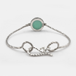 Hard silver bracelet inlaid with deep green opalite